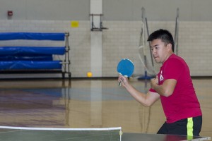 Ken “Tang” Nguyen returns a serve in his table tennis match. Photos by Bogdan Sierra Miranda/The Collegian