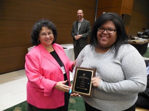 Diana Fuentes of the San Antonio Express-News gives editor-in-chief Jamil Oakford the APME award March 28 in Waco. Photo special to The Collegian