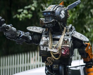 A robot with feelings, Chappie must prove his toughness to a group of gangsters.  Photo courtesy Columbia Pictures