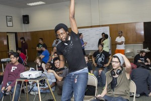 Da’Ron Samson celebrates his progression to the next round as his opponents sit in disbelief during South Campus’ inaugural Super Smash Bros. gaming tournament on April 2.  Photo by Bogdan Sierra Miranda/The Collegian