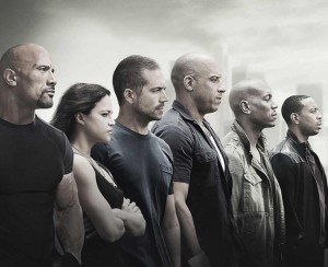 Furious 7 features returning stars such as Dwayne Johnson and Vin Diesel. At the end of the film, the cast pays tribute to the late Paul Walker. Photo courtesy Warner Bros.