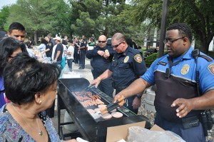 South Campus Lt. Greg Bowen and patrol officer Keith Foster grill burgers and hot dogs during a barbecue on South Campus April 8. The event was an outreach from three police departments to help promote goodwill between police and the community in light of recent local and national events that have caused the public to distrust law enforcement. Photos courtesy Alex Roper