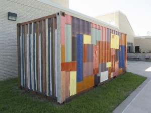 The storage container decorated by the NW Arts Coalition sits behind the Fine Arts Building. Students and art faculty painted the container using many colors. Photo by Hope Sandusky/The Collegian
