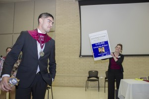 NW student Ismael Castaneda learns he has just won a $40,000-per-year scholarship.
