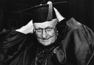 Joe B. Rushing adjusts his cap as he prepares for one of several graduations he presided over.
