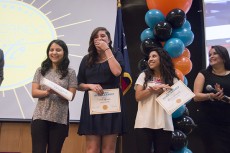 Students Andrea Torres, Delia Morales and Marina Hernandez receive certificates at the event.