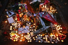 Candles, flowers and notes are placed around the city of Paris in remembrance of those who died during the attacks, which left at least 130 people dead.Photos by Carolyn Cole/Los Angeles Times/MCT