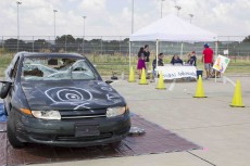 Student Ambassadors hold a car-smashing event for students to let off a little steam on NE Campus in September. The organization is present on all five campuses and works to serve those in need of their help.Collegian file photo