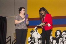 South administrative assistant Belinda Lopez presents Daija Farmer with an award during Celebrating Strides Feb. 24. NW Campus hosted the districtwide event. 