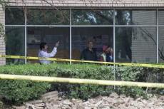 Students look at the damage severe winds caused on NW Campus March 8. The board approved contracts to continue with repairs March 24.Bogdan Sierra Miranda/The Collegian