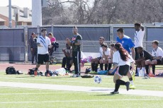 Jose Velarde (center) cheers on members of the SE soccer club during a recent game. The club currently meets 3-4:30 p.m. every Friday at the track field behind the testing center.