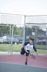 Hoang Ta races for the ball at his tennis match April 21. His partner for the game was Sameer Siddiqi, who he played with only once before. Photos by Katelyn Townsend/The Collegian