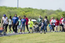 TCC students and their families band together and participate in a walk in 2014 to bring suicide prevention to the forefront. This year, TRE Campus will hold the walk starting at 9 a.m. April 30.Collegian file photo