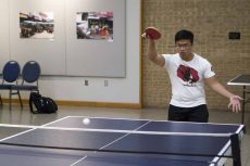 NE student Hoang Ta shows off his strong pingpong serve during the April 27 NE Campus tournament.Joshua West/The Collegian