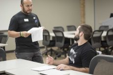 NE financial aid specialist Joe Rodriguez explains the importance of budgeting to student Jeremy Fanche during an Oct. 31 workshop. Rodriguez encouraged attendees to complete cashflow statements to assess their finances. Bogdan Sierra Miranda/The Collegian