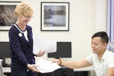 SE ESOL instructor Mary Cinatl hands back graded homework to student Khoa Tran. Cinatl was recognized by her peers with the 2016 Chancellor’s Award for SE Campus. Photos by Bogdan Sierra Miranda