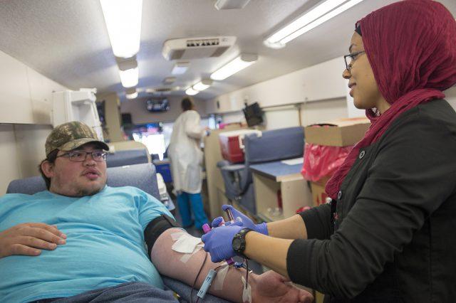 Carter+BloodCare+phlebotomist+Zainab+Mohammad+takes+blood+from+South+student+Christian+Dillon+during+a+blood+drive+on+South+Campus+Sept.+6.+Dillon+tries+to+donate+whenever+he+can%2C+he+said.