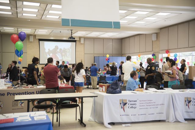 Students visit booths from NW clubs and organizations, including one from the TCC police department at the Sept. 7 Northwest Fest in the student center.