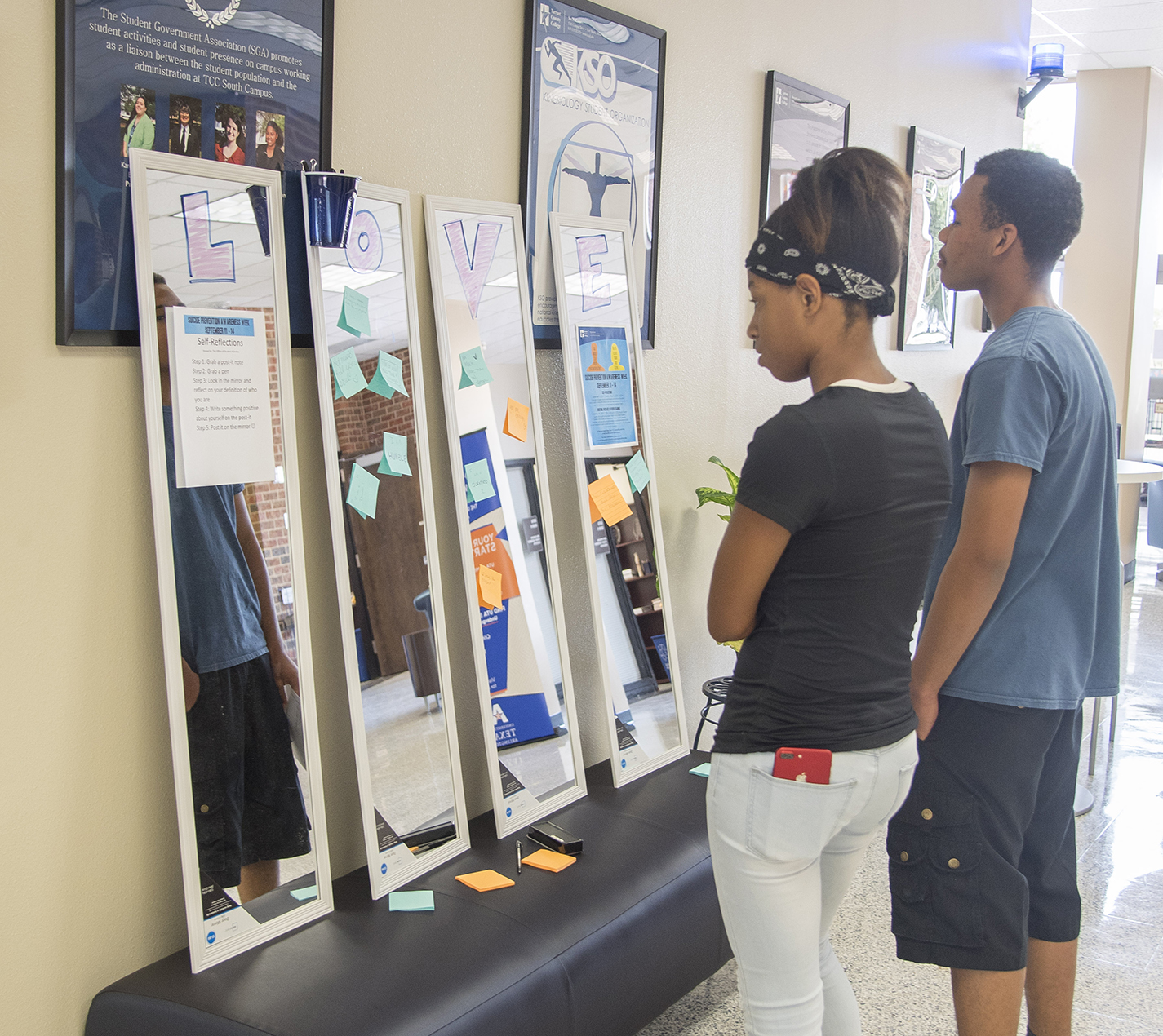 Keundrea Gunnell and Charles Mitchel look at the messages left by students on Sept. 11.