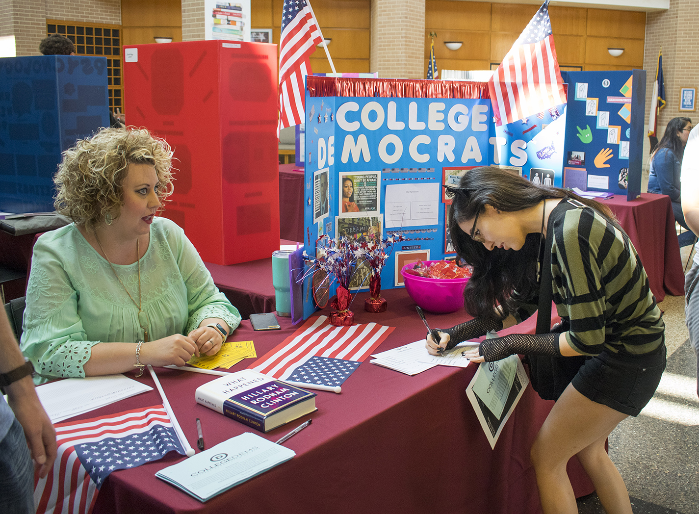 SE student Julie Rodriguez signs up for more information about the College Democrats from club vice president Summer Hall at the SE Club Expo earlier this month.