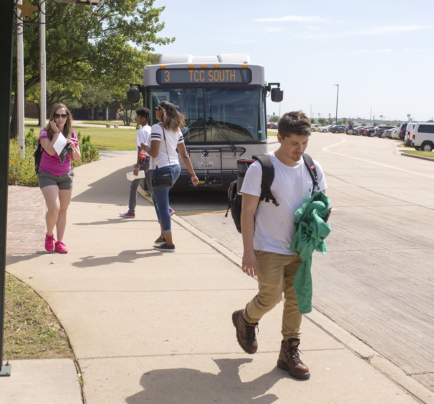South students walk past the bus stop Sept. 30. South is one of three TCC campuses on The T’s routes. Student input is being sought by the district as it looks to make transportation more accessible for students.