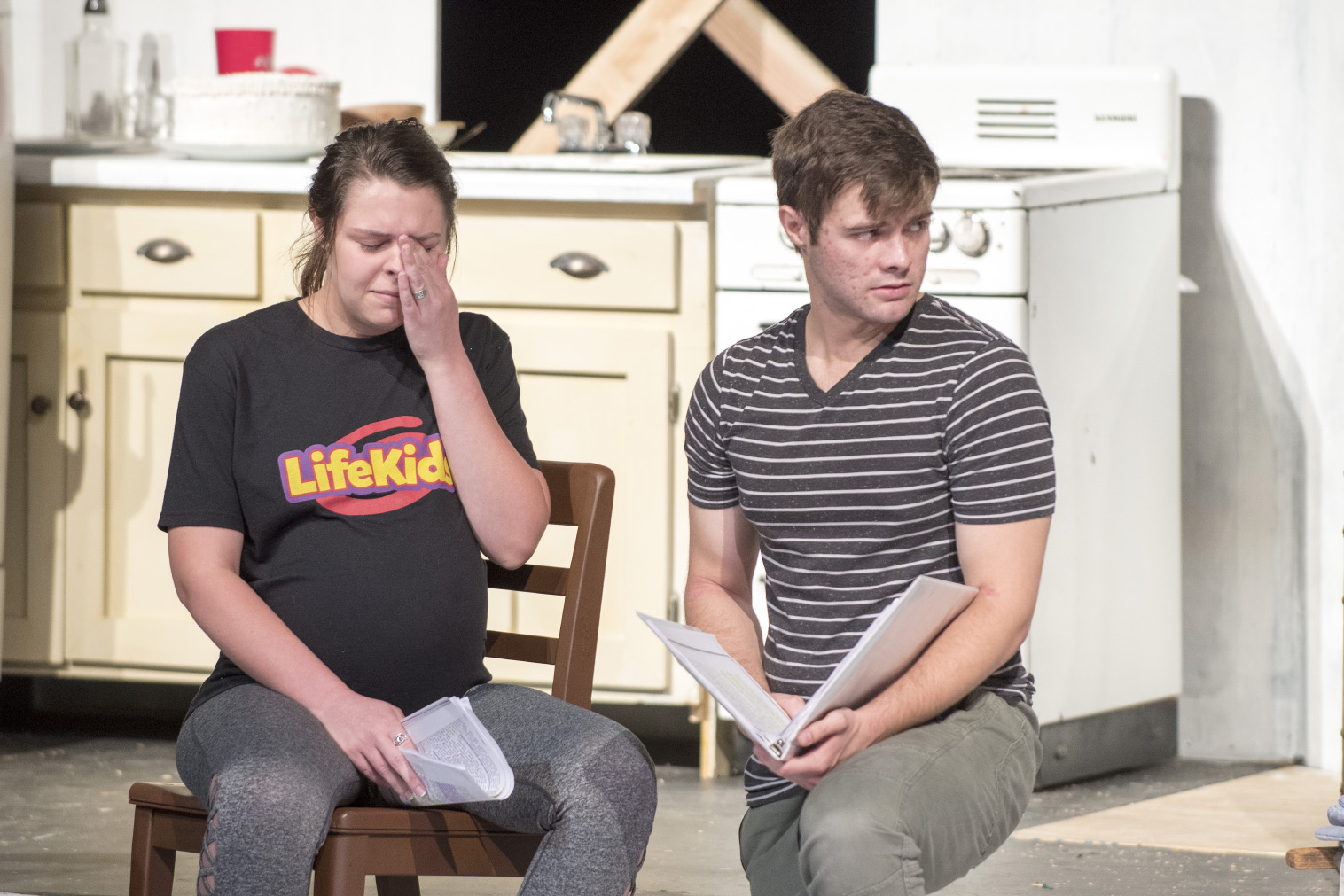 Stella, played by Caitlin Ferguson, cries as Stanley, played by Michael Michel, looks away during rehearsal of A Streetcar Named Desire, which runs on NE Oct. 11-14.