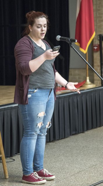 NE student Lara Mandel recites her poem “Silence” at the Poetry Slam and Open Mic Oct. 17