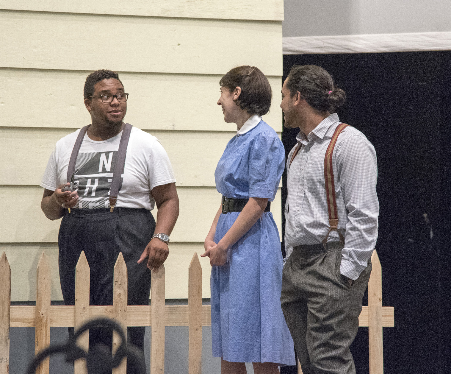 Rickie Jones, playing the role of Jim Bayliss, talks with castmates Sarah Adams, who plays Annie Deever, and Tomas Moquete, who plays Chris Keller, during a scene from the family-oriented play All My Sons.