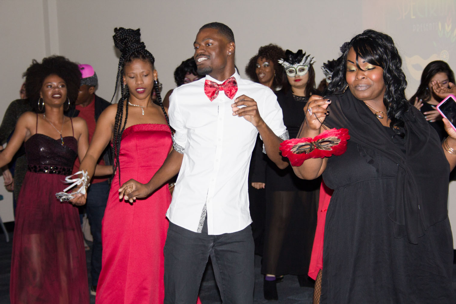 South students Jessica Hughes, D’Ante Stone and Halie Jeanice gather on the dance floor to dance along to “Cupid Shuffle” during the 2016 Spectrum Ball.