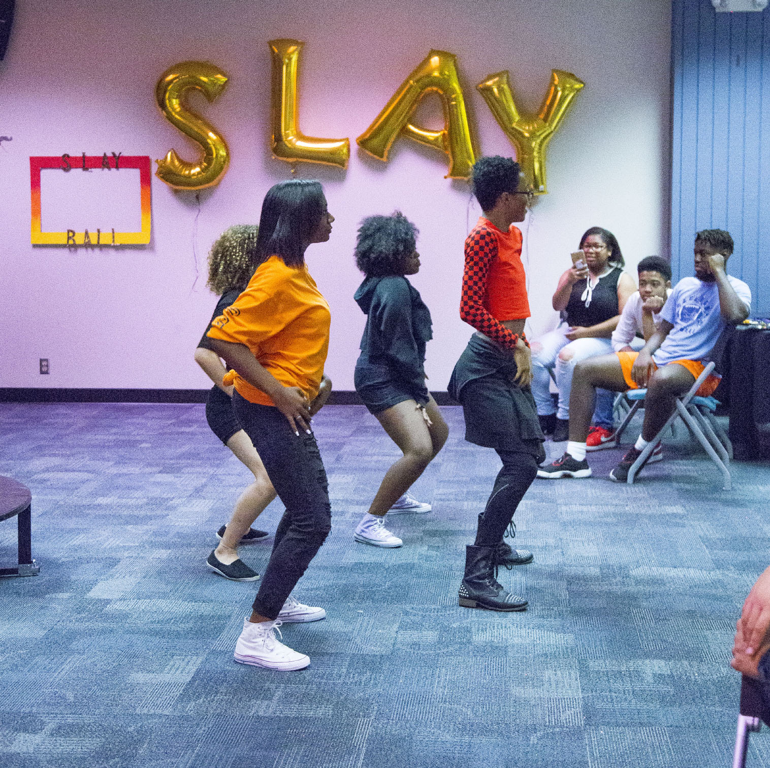 South students Sydney Gholston, Christian Bell, Anastasia Alford and Tasneem Alhanawi perform a group dance during the South Campus Spectrum Club’s Slay Ball Nov. 17.
