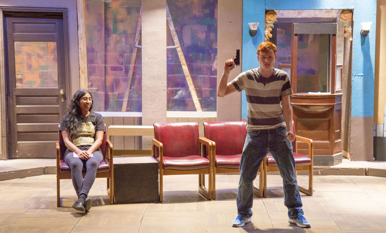 South students Hima Mettu and Christian West rehearse a scene from Passengers during a rehearsal Oct. 31. The cast consists of four actors who play 18 characters in eight scenes, all set in a Midwest bus station.