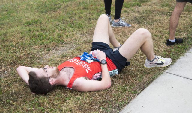 TR student Ben Lamb lies on the ground after running in the Toro Dash 5K race Nov. 4. Despite running in the wrong direction with about 400 meters left in the race, he crossed the finish line first with a time of 20 minutes, 11 seconds. About 300 people participated in the race.