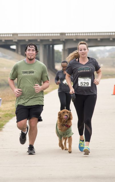 Fort Worth residents Gene Williams and Halley Seyfried ran with their dog in the 10K race during the Toro Dash.
