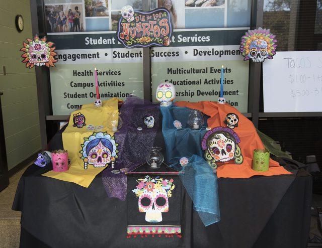 NE+students+participate+in+a+Mexican+tradition+Nov.+1+that+involves+placing+decorated+sugar+skulls+and+candles+on+the+altar+to+honor+loved+ones+who+have+died.+The+event+is+a+cherished+holiday+within+the+Mexican+culture.