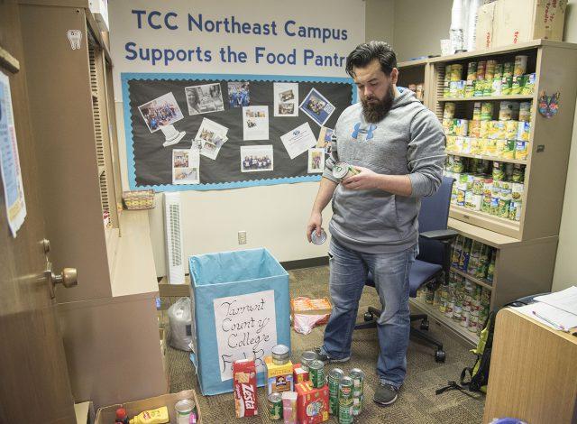 NE student worker Lance Lambert sorts and organizes donations at the NE food pantry. Lambert keeps track of the donations and stocks the shelves in NCAB 1136A.