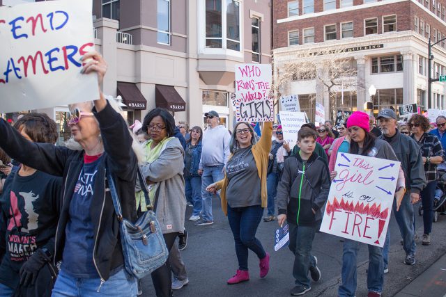 Activists march down the streets of downtown Fort Worth Jan. 20 during the Women’s March to show their support for equal pay, female empowerment and other issues women face.