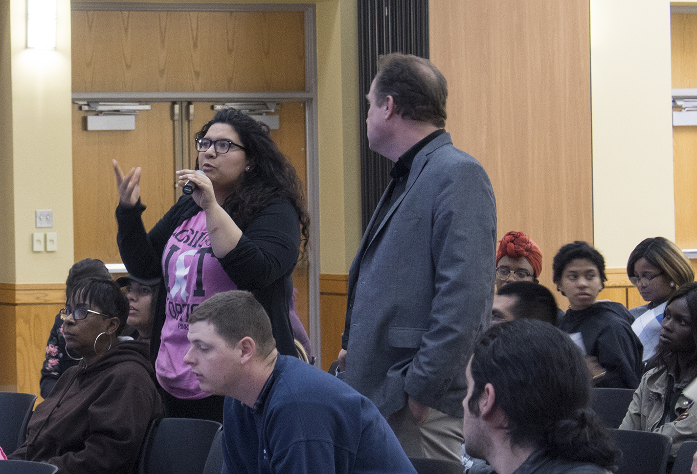 SE nursing student Brittney Candia stands with behavioral and social sciences chair Des Robinson and asks a question during speaker Lisa Wade’s presentation Feb. 7.