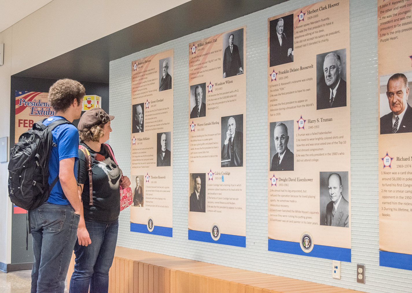 SE students Emily and Leon Nibarger take time to look at the Presidents Day exhibit on campus Feb. 20. The exhibit was SE’s way of celebrating the holiday.