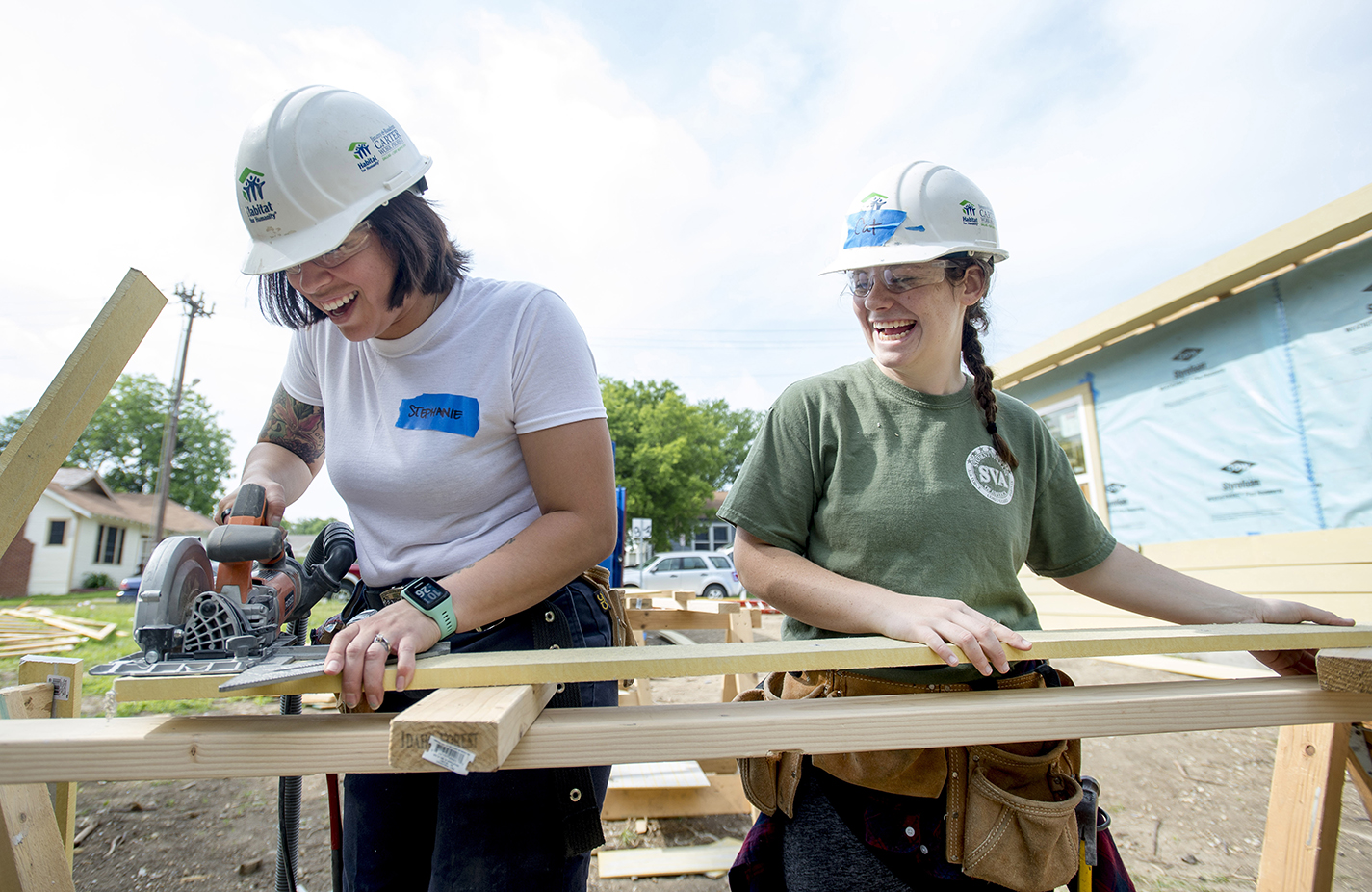 South students Stephanie Clements and Caitlin Lewis help give back to the community while working toward building a home for someone in need. NE students can volunteer to help out in the community during the campus’ Big Day of Service April 2.