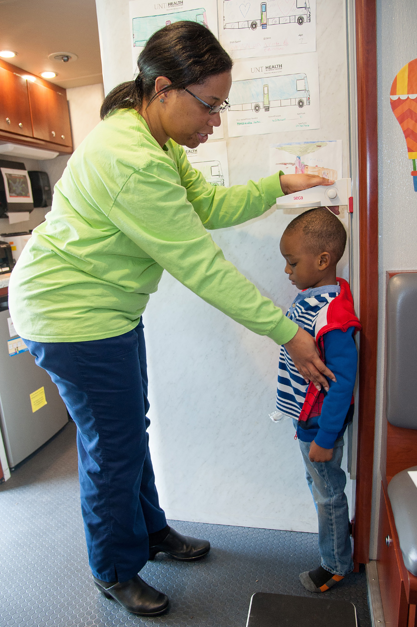 A young child attending last year’s African-American Health Expo is measured for his height. This year’s expo will be April 21 on South.