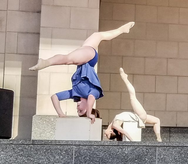 Two dancers perform during Merge, a district dance concert April 12 in Sundance Square.