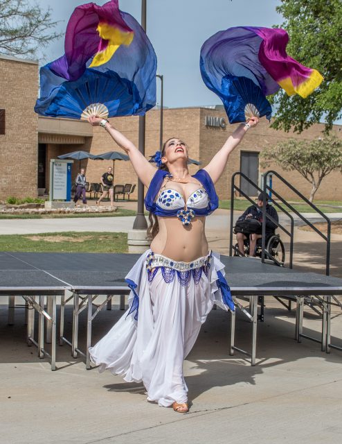 Local belly dancer Sa’diyya performs for students, faculty and staff April 11 at NE’s International Festival.