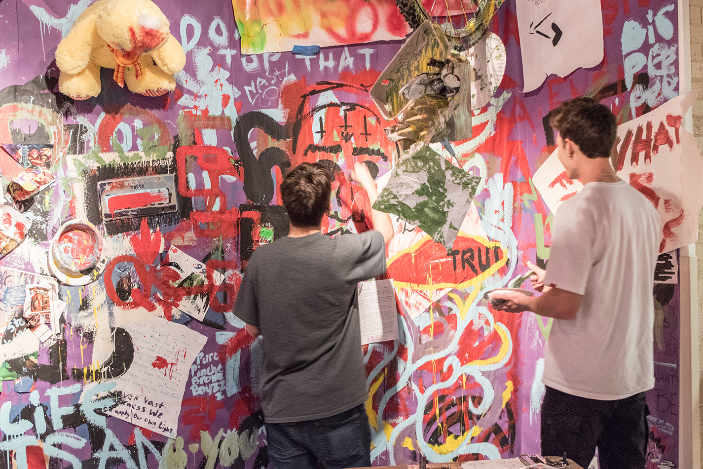 NW students Quinton Bailey and Spencer Alexander add to the collective art mural during the art-centered weeklong event in the Lakeview Gallery.