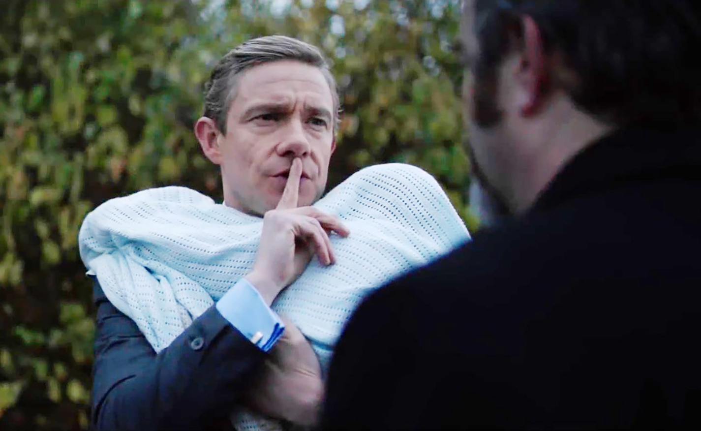 Mike Priddle, a businessman played by Martin Freeman, questions the motives and past of Professor Goodman, played by Andy Nyman. The conversation occurs during Priddle’s story in the anthology horror film.