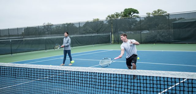 NE students and Tennis Club members Khanh Tran and David Schwartz practice April 2 on NE Campus in preparation for their trip to the national tournament April 12-14 in Orlando, Florida.