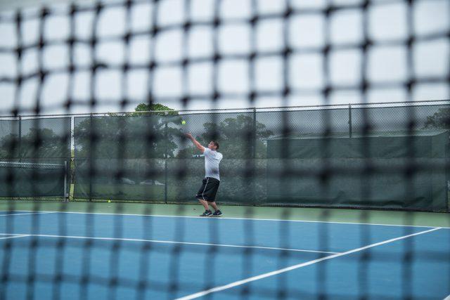 NE+student+David+Schwartz+serves+during+practice+before+the+NE+Tennis+Club+travels+to+the+Tennis+On+Campus+National+Championship.