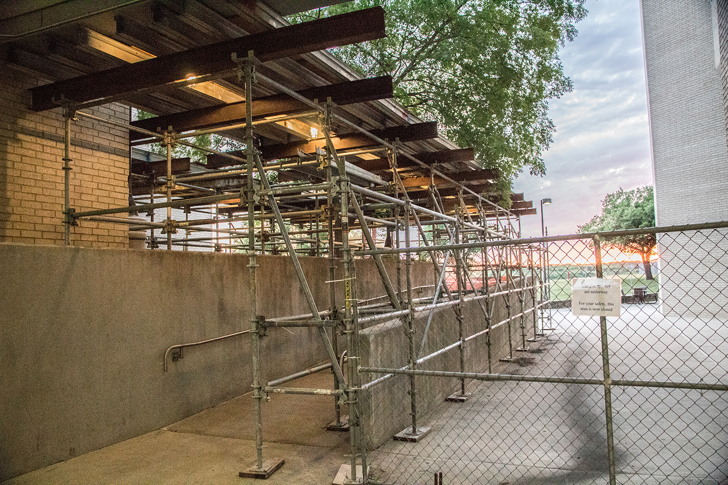 Scaffolding and structures fill the walkways between the WSTU, WTLO and WPHE buildings to protect students from overhead debris.