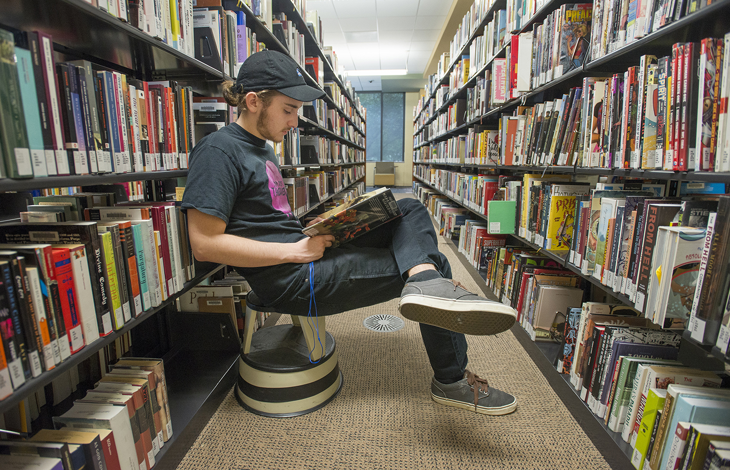 NW student Ashton Hinrjos passes time before his next class by sitting and reading in the TR library. TCC’s libraries provide students with a range of services.