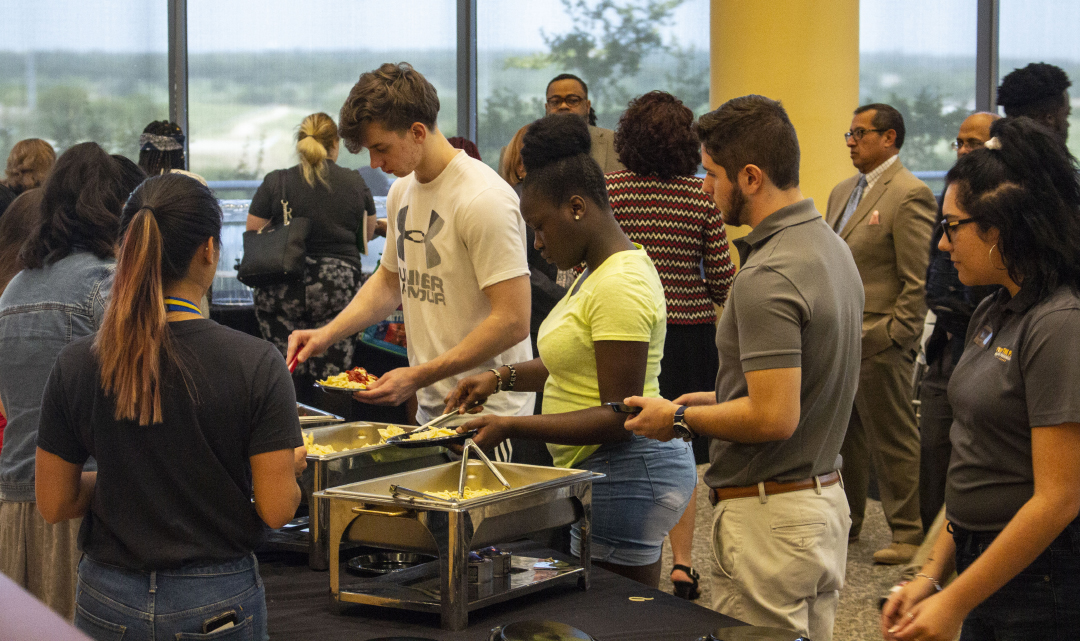 Students, faculty and staff grab pasta during TR Campus’ Pasta with the Prez Aug. 23 in the Riverfront Cafe. Campus president Sean Madison listened to students and answered their questions during the event.