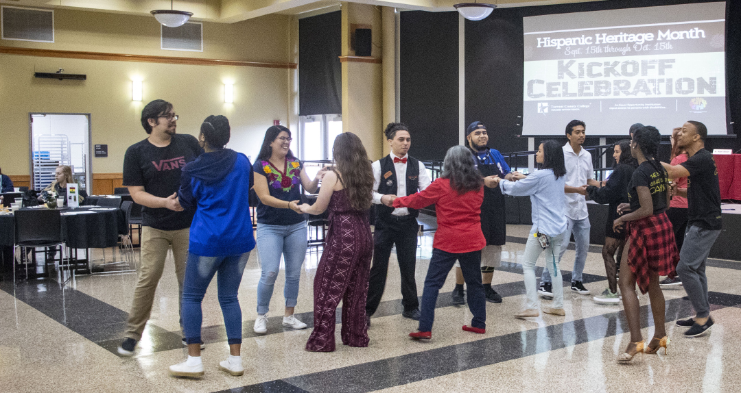 Pura Vida Afro Latin Dance instructors Juleon and Anais teach the bachata dance style to SE students at the Hispanic Heritage Kick-Off Sept. 12. Elote Mexican Kitchen also provided food for attendees.